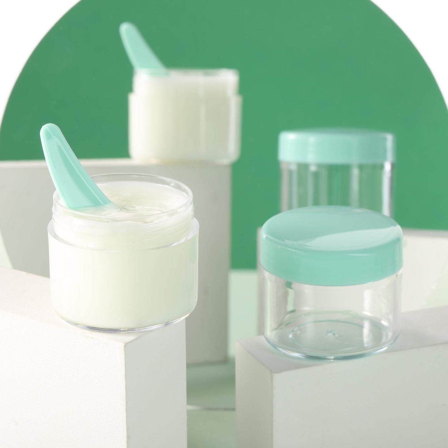 Refillable Cosmetic Sample Jars - 100 Pack 20g (0.7oz) Green Small Travel Containers with Lids + 10 Mini Makeup Spatulas - BPA Free